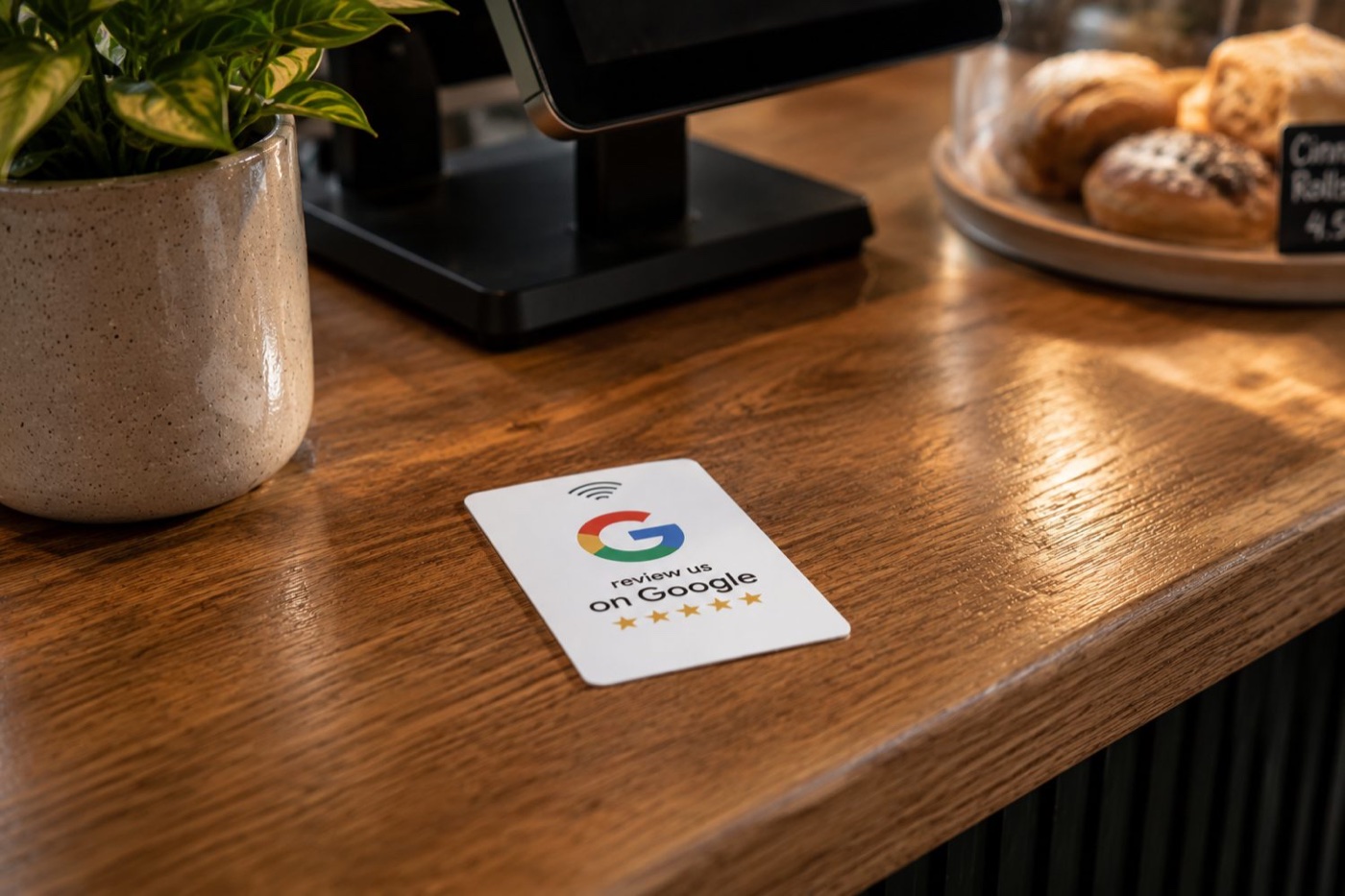 NFC Google review plaque displayed on a counter